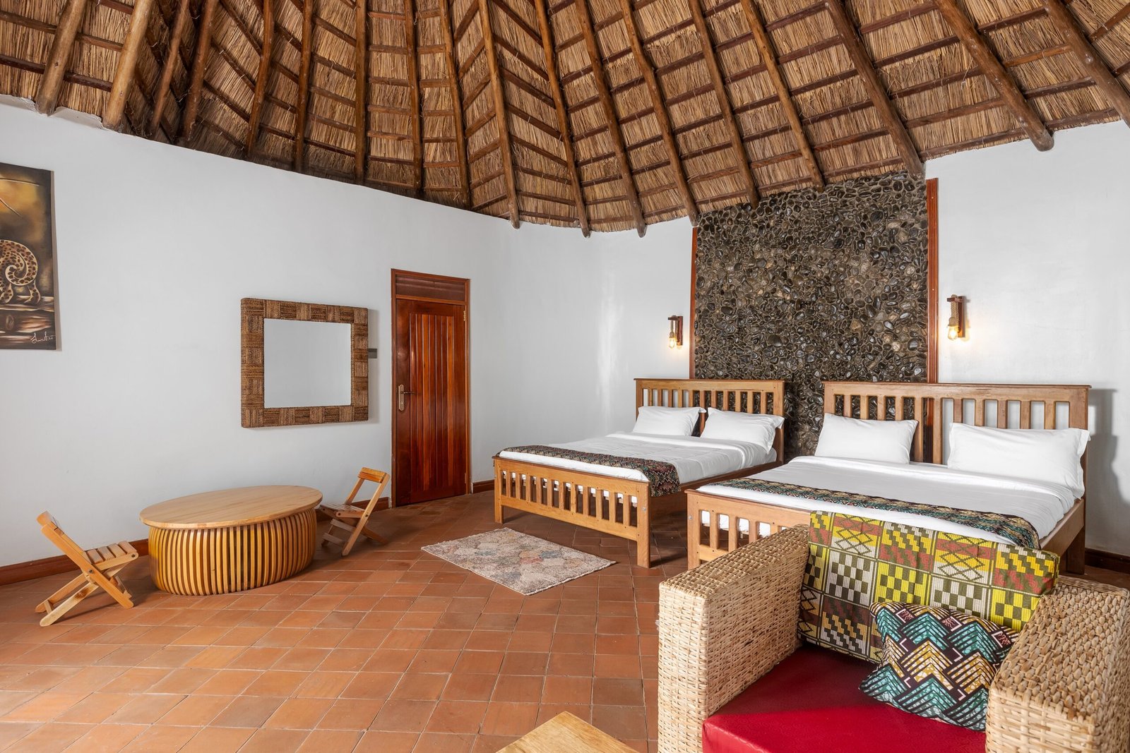 Shared cottage interior with handcrafted details near Kibale Forest