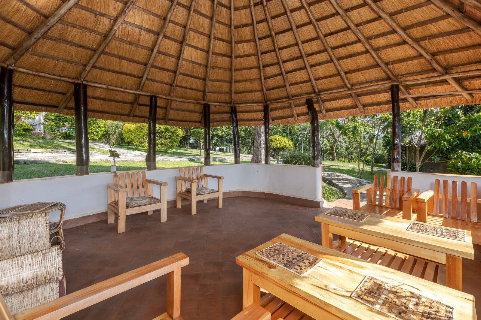 Tables arranged for a relaxed lakeside meal near Fort Portal